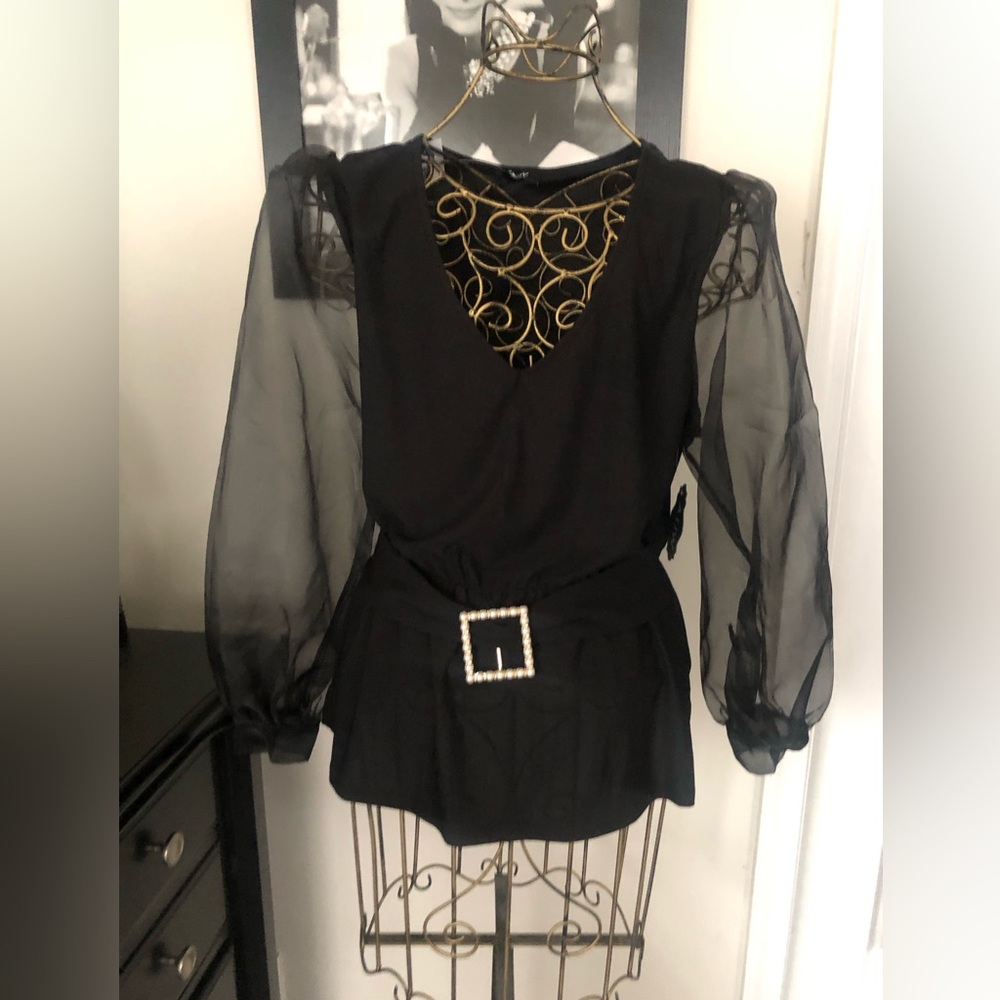 Black peplum blouse, sheer sleeves, pearl embleshlisment around the waist